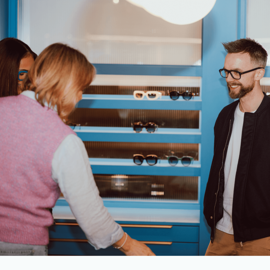Client receiving personal help choosing glasses at Stanley Square Opticians in Sale